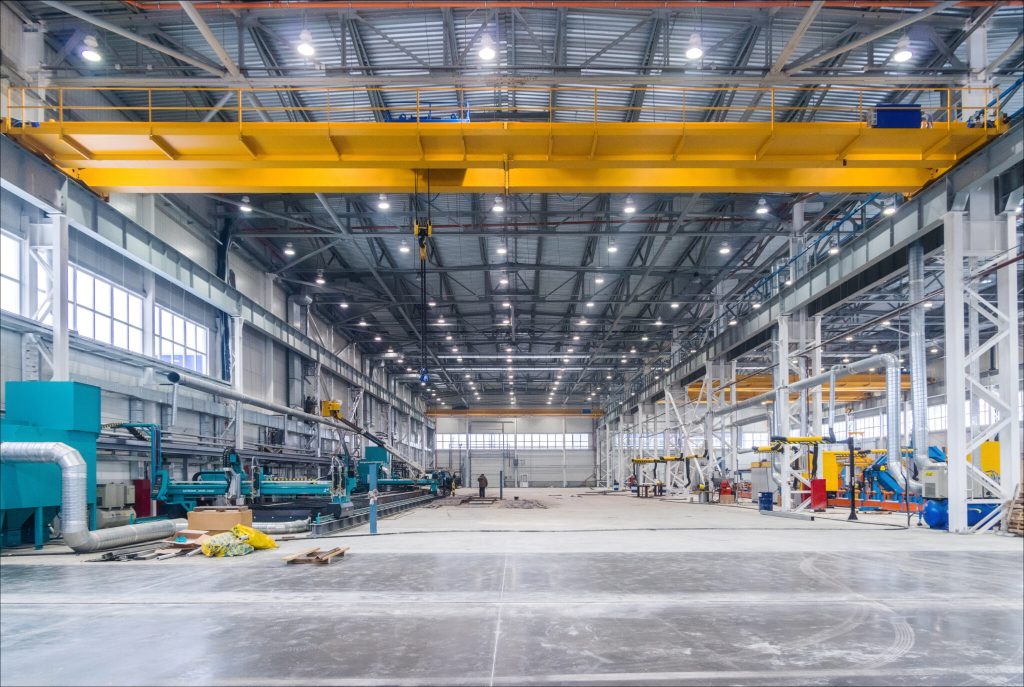 Sand casting process in Dubai showing molten metal poured into molds